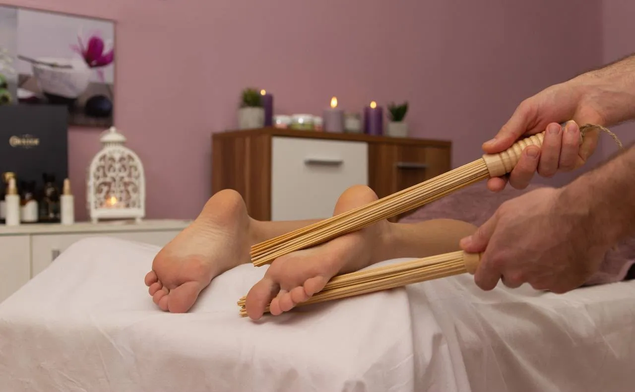 Bamboo sticks used on the soles of a client's feet